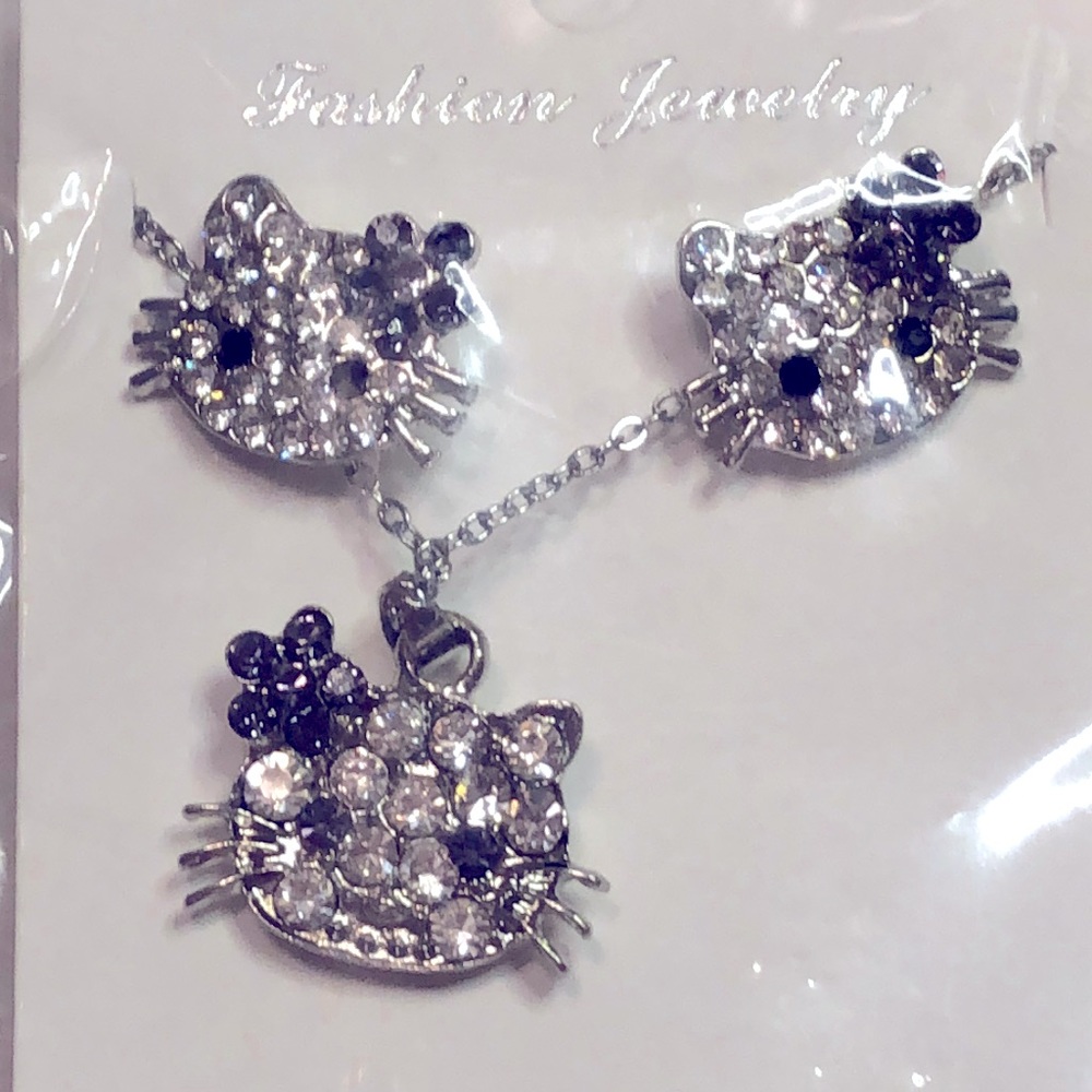 NWT Hello Kitty Necklace and Earrings Set. Perfect gift for Easter.
